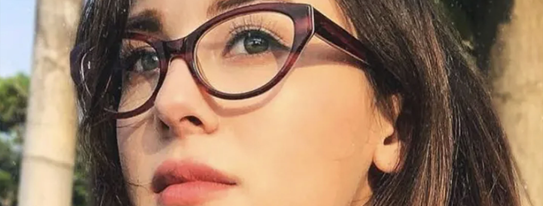 close up image of woman wearing soft cat eye eyeglasses