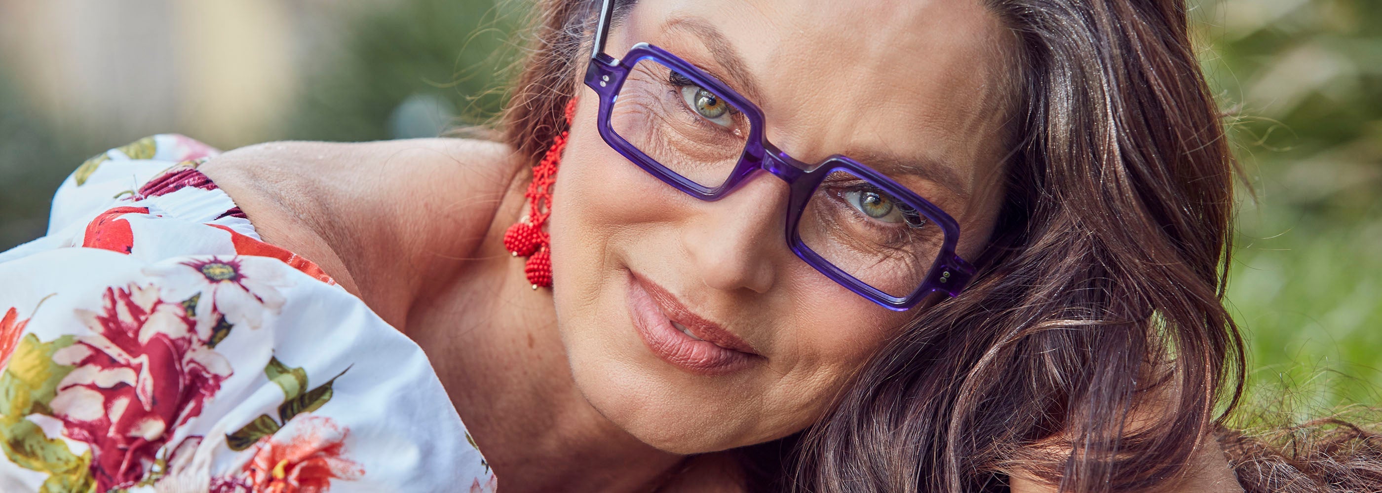woman wearing square blue acetate eyeglasses